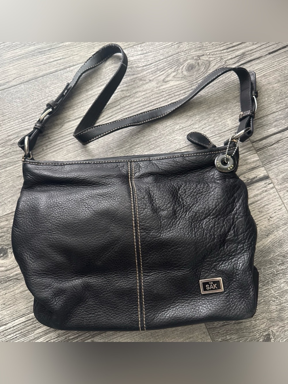 The Sak Black Pebbled Leather Shoulder Bag with Silver Accents